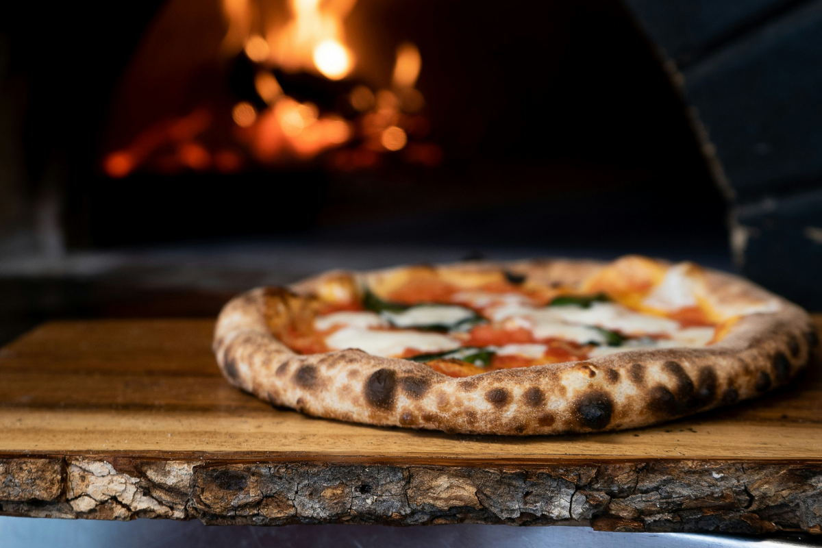 Wood-fired margherita pizza fresh from the oven